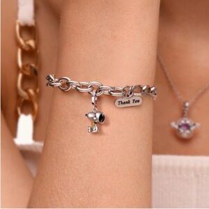 Snoopy hugging Woodstock silver charm